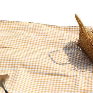 Waterproof orange and white gingham picnic mat for outdoor camping and beach trips