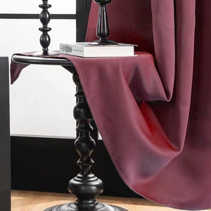 Modern minimalist solid burgundy blackout curtains with premium silk gloss and heavy drape