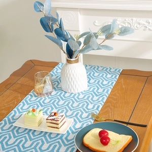 Modern minimalist table runner with blue and white geometric patterns for dining table decor