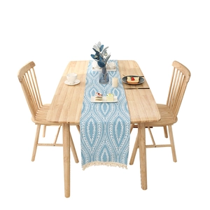 Bohemian sky blue table runner with white leaf patterns and handmade woven tassels