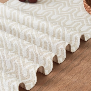 New Chinese style jacquard table runner with beige geometric wave patterns on wood