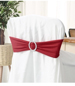 Detail of dark red elastic chair sash with oval sparkling rhinestone buckle for weddings