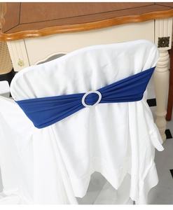 Detail of royal blue elastic chair sash featuring a sparkling round rhinestone buckle
