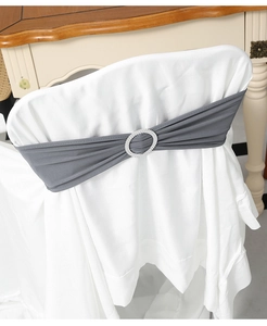 Close-up of grey elastic chair sash with oval rhinestone buckle for banquet decoration