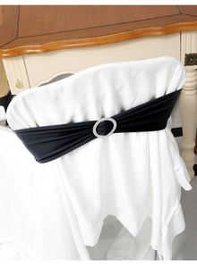 Detail of black elastic chair sash with a sparkling silver rhinestone buckle for events