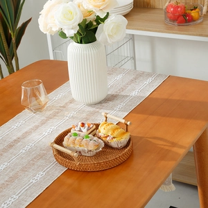 Modern fabric table runner with tassels and geometric embroidery for home decor