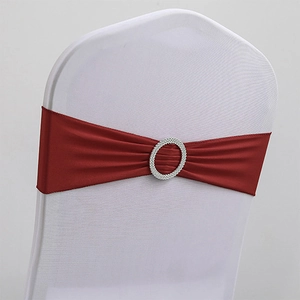 Burgundy satin chair sash with silver rhinestone buckle on white seat cover
