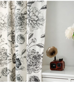 Macro shot of French floral linen curtain featuring vintage peony and rose patterns