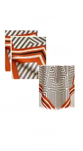 Detail view of the machine-stitched edge and geometric maze print on this silk square scarf