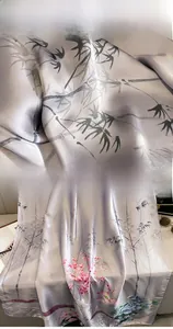 Detail of printed silk scarf showing high-quality stitching and ink floral patterns