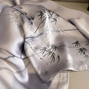 Detailed view of silver-purple silk scarf featuring traditional bamboo ink painting patterns