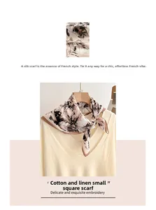 Detailed close-up of soft linen-cotton square scarf with brown floral ink pattern