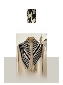 Detailed macro view of houndstooth cotton linen scarf showing fabric texture and stripes