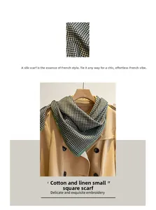 Detail of houndstooth cotton linen scarf showing fabric texture and styled with a coat