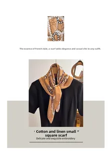Detail of linen square scarf with white rope pattern and elegant French style draping