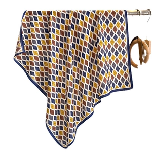 Elegant geometric diamond pattern square scarf in blue and yellow tones for women