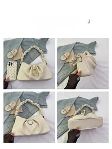 Detailed multi-angle views of a cream pleated cloud bag with a gold horseshoe buckle