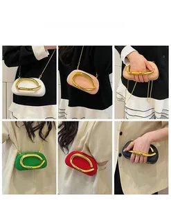 Detailed views of crossbody clutch bag with large gold ring handle in various colors