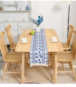 Close-up of blue floral cotton linen table runner with delicate handmade tassels