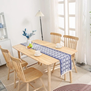 Modern blue and white geometric striped table runner with white decorative tassels