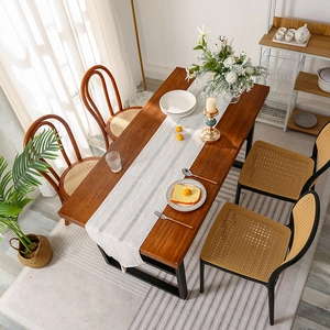 Modern woven table runner with white and grey diamond pattern and elegant tassels