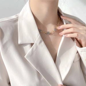 Modern mixed metal pig nose anchor chain necklace in gold and silver finish for women