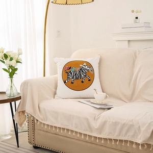 Square cushion cover with cartoon zebra embroidery on modern white sofa
