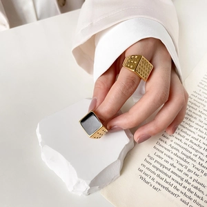 Minimalist gold rings with black square stone and textured grid design for women