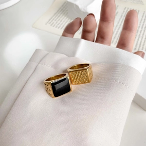 Minimalist gold square signet rings with black inlay and geometric textured engraving