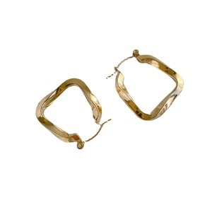 Minimalist gold U-shaped twisted geometric square earrings with a polished finish