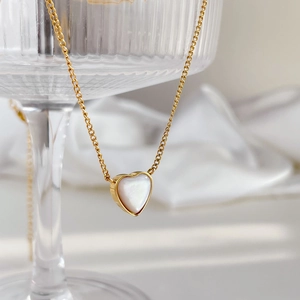 Gold heart pendant necklace with white mother of pearl inlay on thin cable chain