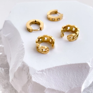 Gold star chain ear cuff and huggie hoop earring set for non-pierced ears on white stone