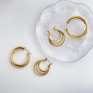 Elegant multi-layered gold hoop earrings set with minimalist geometric circular design