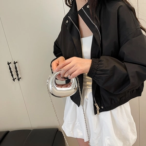 Mini metallic silver egg-shaped handbag with slim metal chain strap and mirror finish