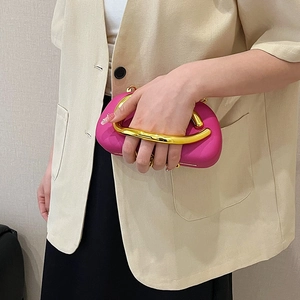 Elegant magenta evening box bag with a distinctive large U-shaped gold metal handle