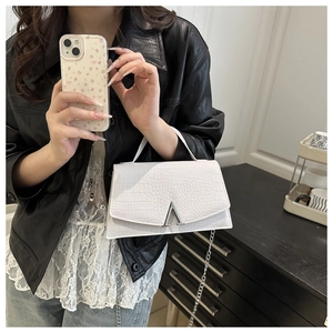White croc-embossed crossbody bag with silver V-logo hardware and metal chain strap