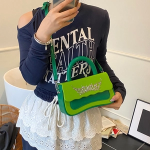 Fashionable green crossbody box bag with metallic embroidery detail and wave flap