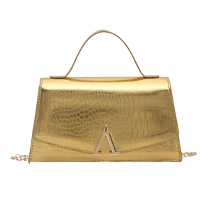 Luxurious gold crocodile pattern handbag with elegant metal handle and chain strap