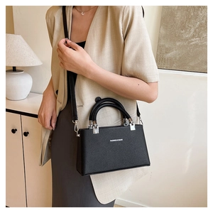 Model view of black lychee grain crossbody box bag with Fashion & Bags lettering
