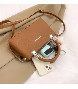 Top-down view of a brown lychee pattern leather handbag showing spacious inner storage space
