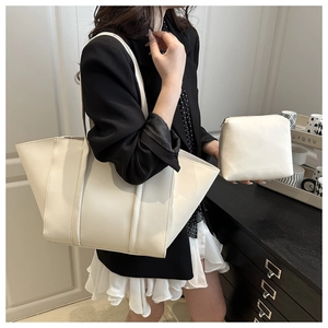 Minimalist white tote bag with matching zippered pouch showing premium faux leather texture