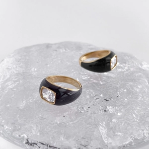 Elegant Mobius rings in gold plating with black enamel and sparkling cubic zirconia stones