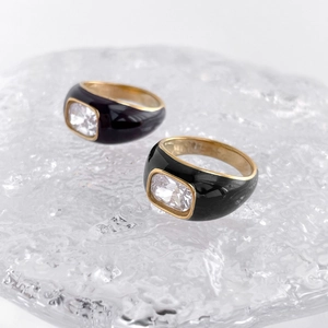 Elegant gold Mobius rings with black enamel coating and sparkling zircon stones