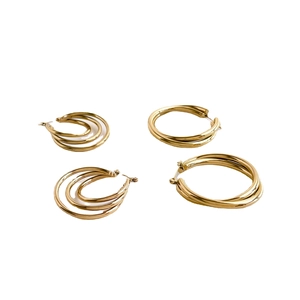 Elegant gold multi-layered hoop earrings set with minimalist circular polished metal design