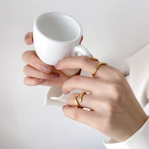 Creative 18K gold plated hugging hands ring with a minimalist polished snake-like texture