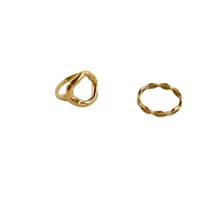 Abstract lip-shaped gold ring set featuring minimalist organic and wavy metal lines