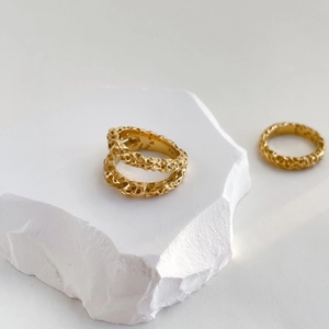 Minimalist double-layer crater ring with gold lava texture on white stone base