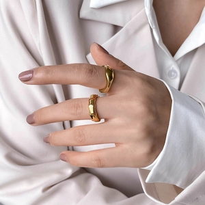 Set of two gold bamboo-style wavy rings with organic lava texture for modern women