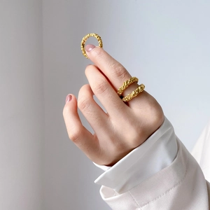 Three-piece gold hammered texture rings with a unique lava design for a minimalist look