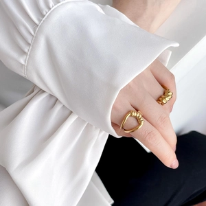 French vintage style braided gold rings set with twisted croissant texture and rope design
